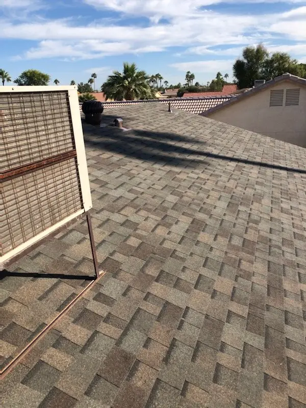New architectural asphalt shingle roof on a Phoenix home surrounded by tile-roof neighbors, by Leal Roofing