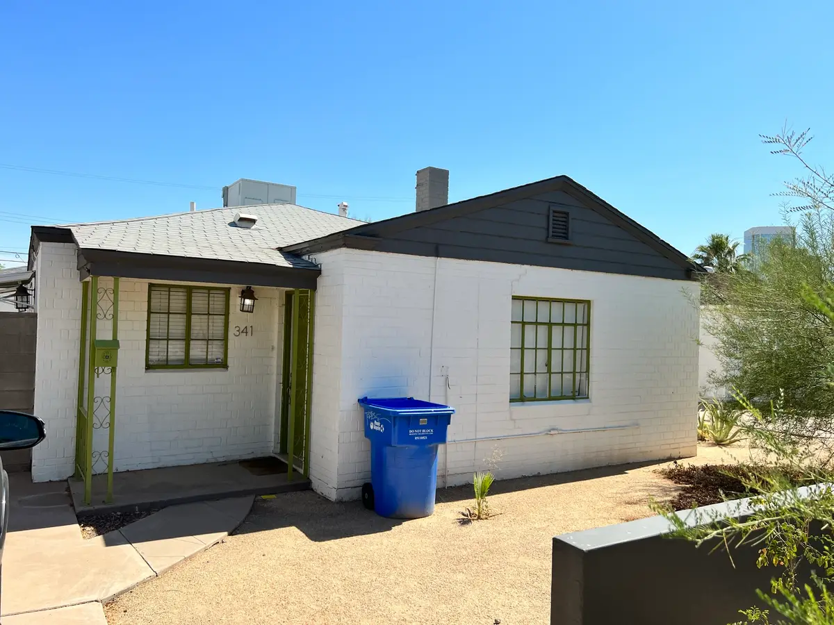 Worn old 3-tab shingle roof and dark weathered fascia before replacement on a central Phoenix home, by Leal Roofing
