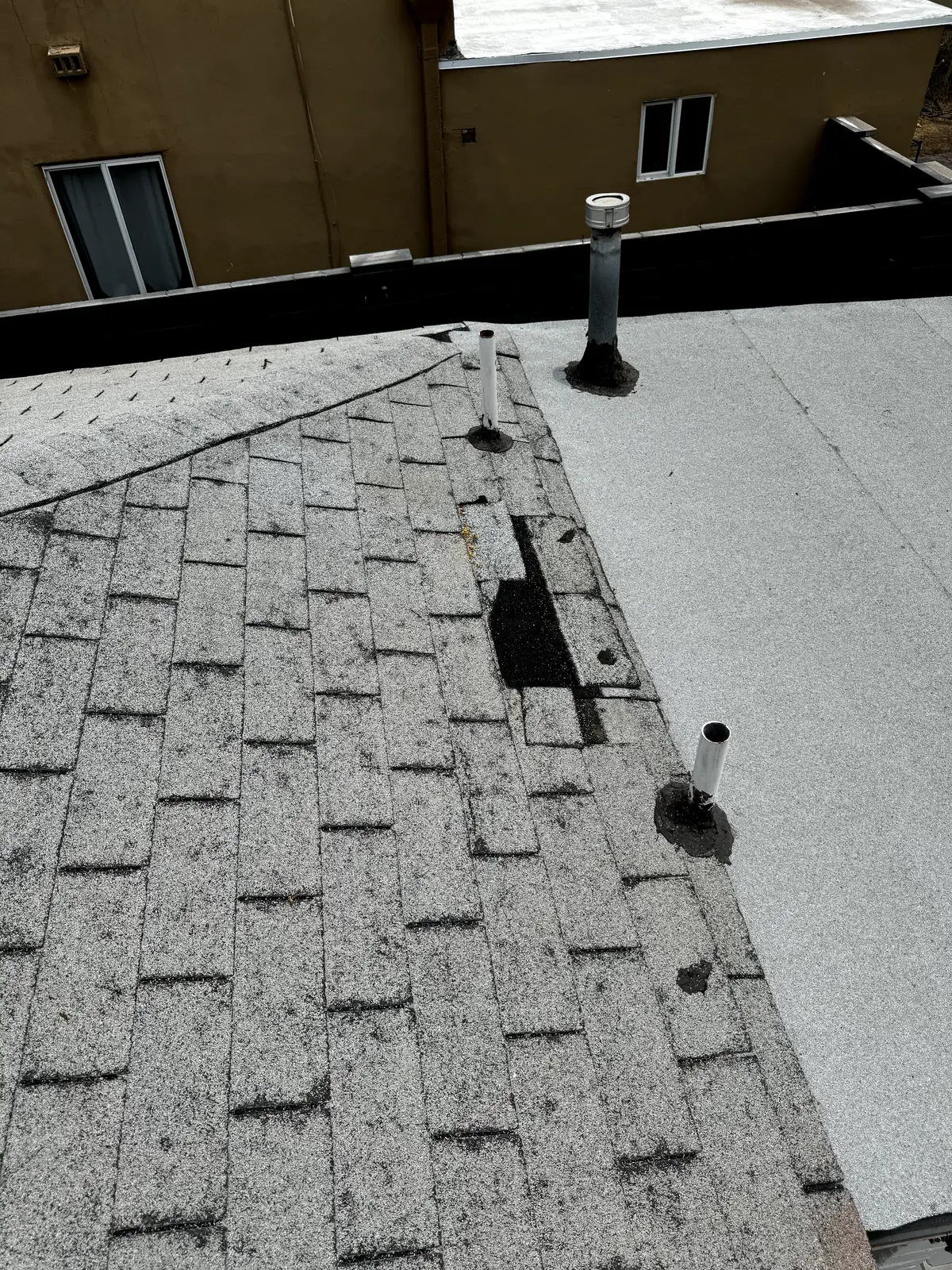 Old worn 3-tab shingle roof during tear-off on a central Phoenix home, by Leal Roofing